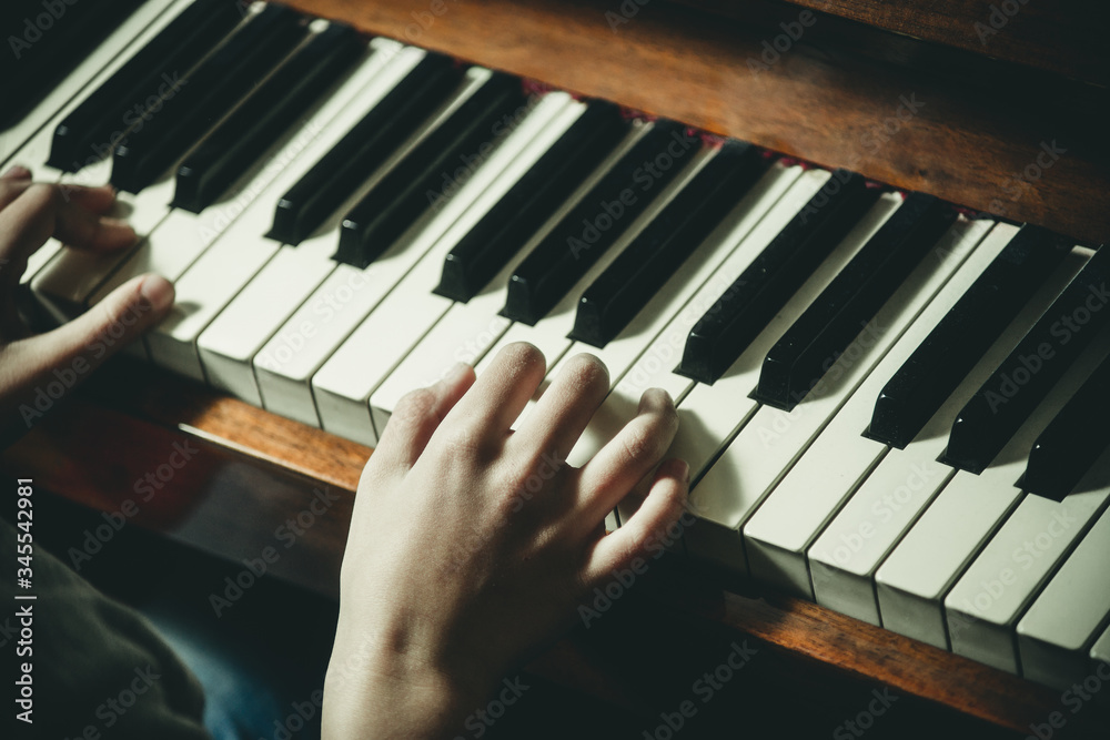 hands on the piano close-up