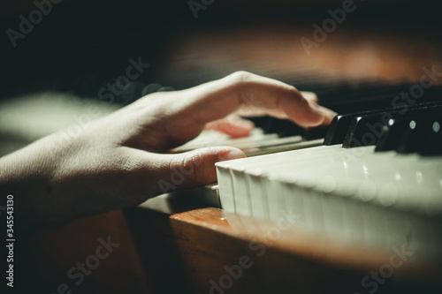 Canvas Print hands on the piano close-up