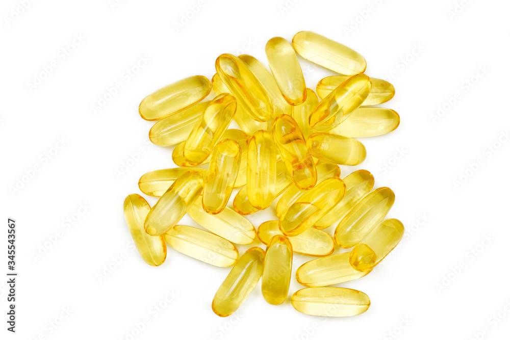 Fototapeta premium Closeup of capsules fish oil with Omega 3 on white background. Top view.