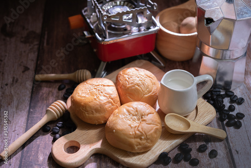 Tasty buttery buns on  wooden table