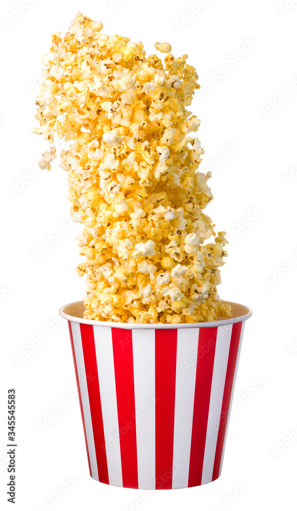 Flying popcorn from paper striped bucket isolated on black background Flying popcorn from paper striped bucket isolated on black background