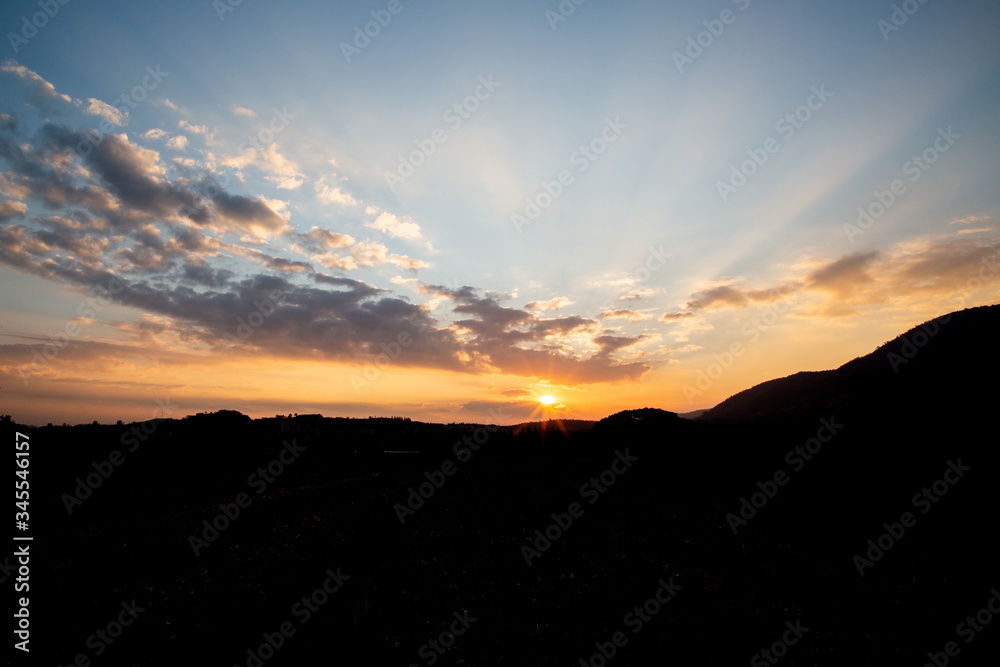 Fototapeta premium silhouette landscape mountain and sun light beam on twilight sky in the morning .