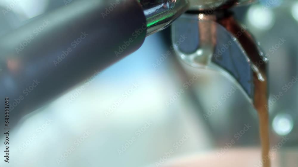 Pouring coffee stream from professional machine in cup. Fresh black coffee pouring from professional machine dispenser in cup Pouring coffee stream from professional machine in cup. Fresh black coffee pouring from professional machine dispenser in cup