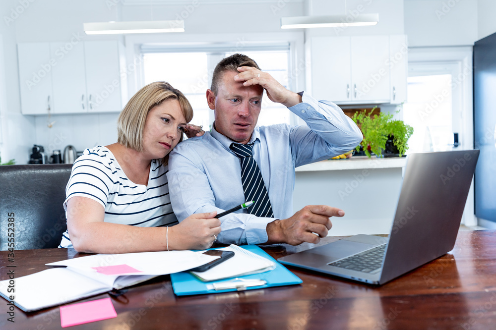 Coronavirus Economic recession. Couple in distress over home finances during Covid-19 shutdown Coronavirus Economic recession. Couple in distress over home finances during Covid-19 shutdown