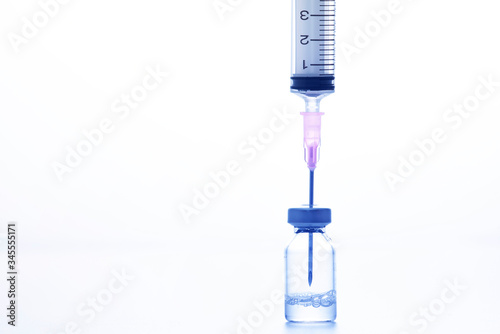 medical drug vial and syringe on wWhite background