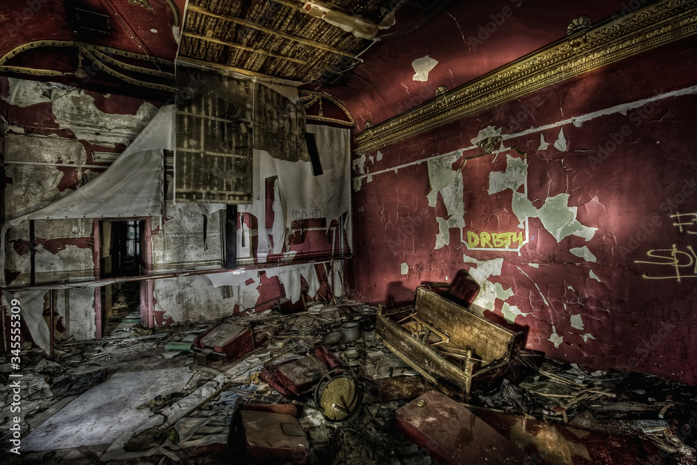 Room with colored mills and a mess in an abandoned movie theater in Russia