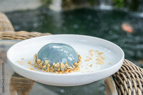 Earl Grey Mousse Cake in white plate, nature background.