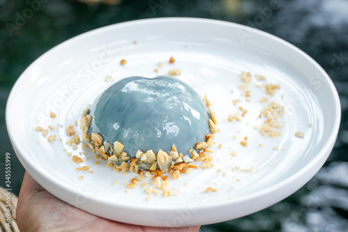 Earl Grey Mousse Cake in white plate, nature background.
