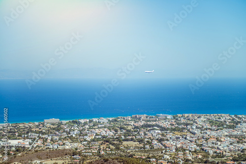 White an air plane fly over the Old Town Kaleici - Antalya, Turkey