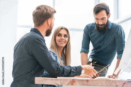 business team discussing financial schedules at work meeting