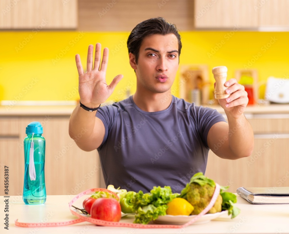 Young man in dieting and healthy eating concept Young man in dieting and healthy eating concept