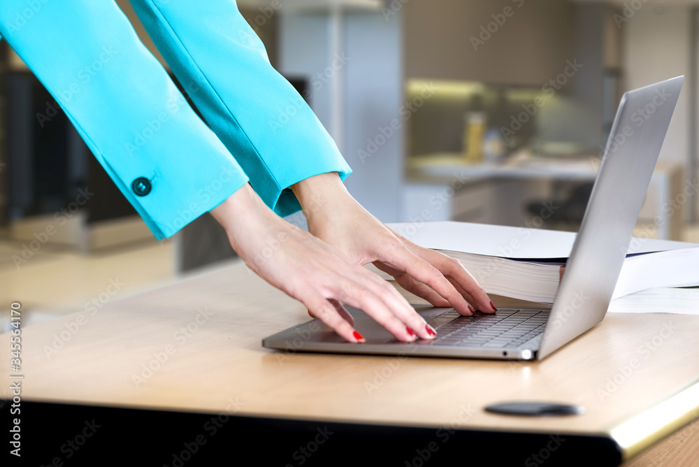 Businesswoman using a laptop working from home