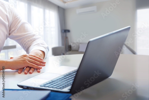 Businessman sitting with a laptop working from home