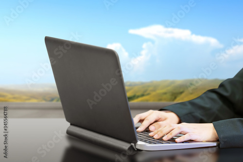 Business people using a laptop working remotely