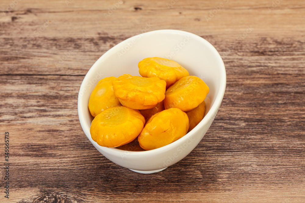 Marinated yellow patisson in the bowl Marinated yellow patisson in the bowl