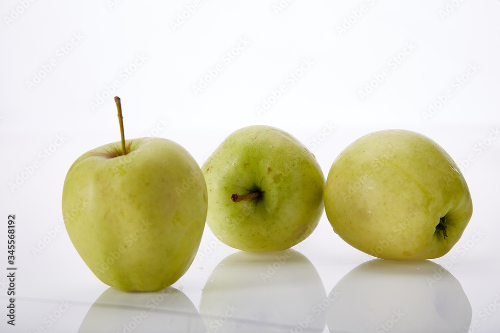 Fresh juicy fruit green apple on white background natural organic delicious nutritious healthy food vegetarian freshness diet vegan. Fresh juicy fruit green apple on white background natural organic delicious nutritious healthy food vegetarian freshness diet vegan.