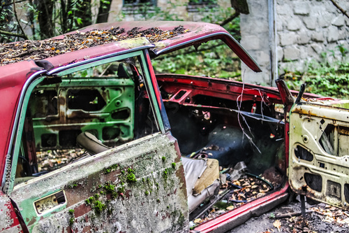 Abandoned car in the middel of the nature on Chernobyl disaster zone.  photo