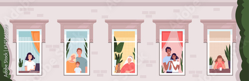 People look out of the windows of the house. Horizontal banner. The concept of social distance, isolation and quarantine due to the coronavirus COVID-19