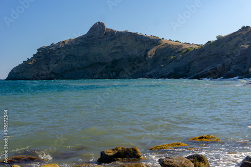 azure sea and bear-shaped rock