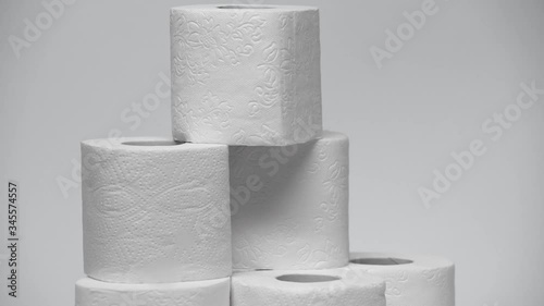stack of clean toilet paper rolling on white photo