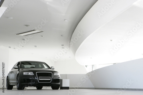 Black car in a white salon