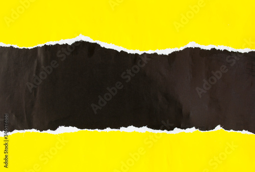 Black and yellow torn and crumpled paper poster. Ripped and peeling grunge paper placards texture background. Copy space for text.
