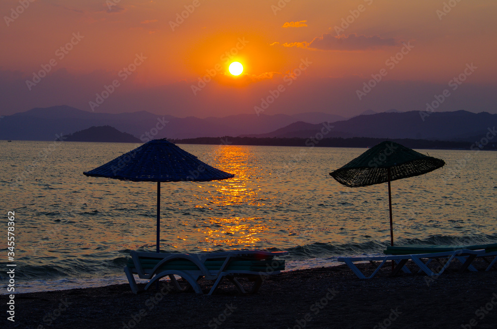 Sunset on the Calis Beach on the Aegean Sea