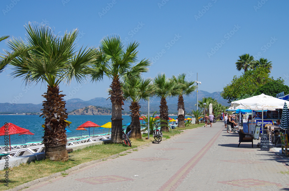 Obraz premium FETHIYE, TURKEY - June, 2019: Calis Beach on the Aegean Sea
