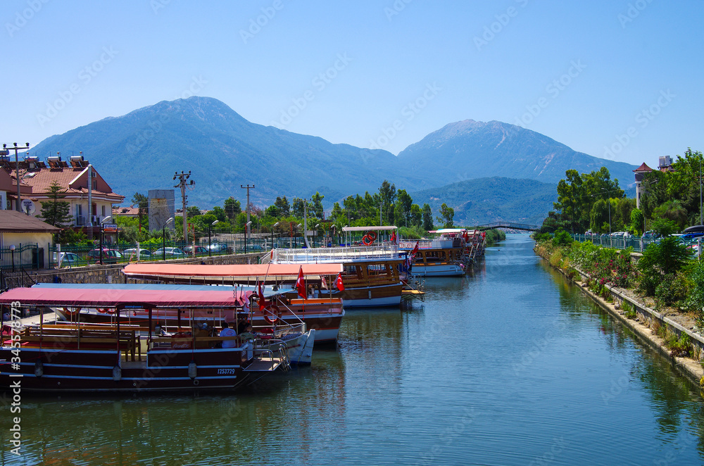 FETHIYE, TURKEY - June, 2019: Calis Water Taxi on the pier FETHIYE, TURKEY - June, 2019: Calis Water Taxi on the pier