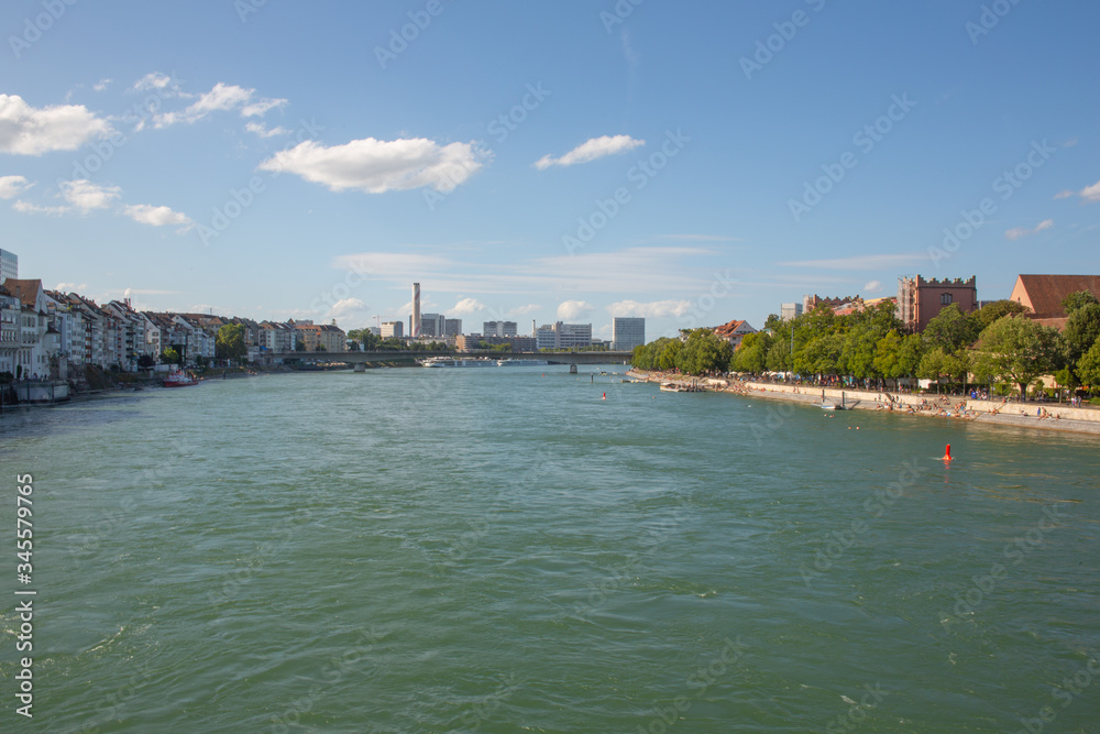 Rhine River flow through Basel Old Town, urban section riverside panorama