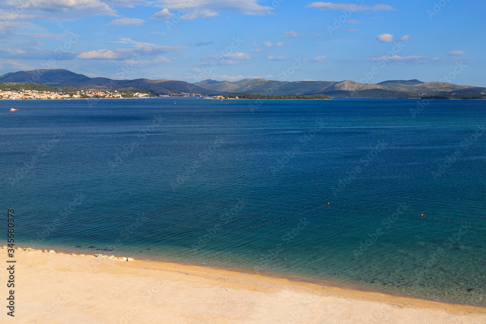 Beautiful Sea background, Croatia. Transparent water on an ecologically clean, picturesque summer Blue flag beach. Croatian sea vacation, travel and tourism, text space Beautiful Sea background, Croatia. Transparent water on an ecologically clean, picturesque summer Blue flag beach. Croatian sea vacation, travel and tourism, text space