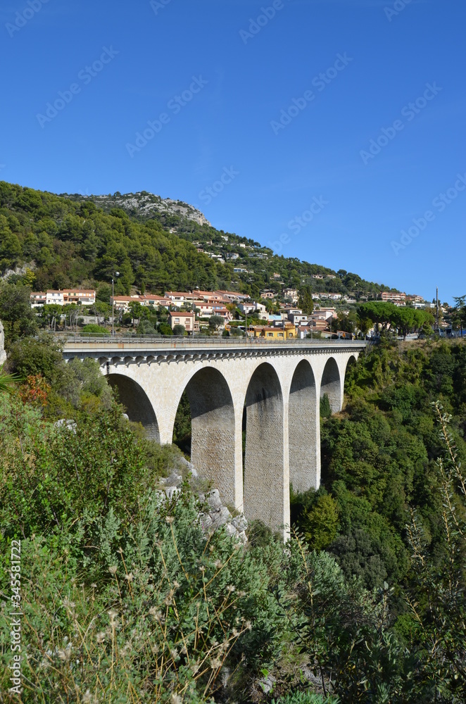 Road from Nice to Italy. View from the Moenne Kornice scenic road to the viaduct (stone Arch bridge) near the Eze village.