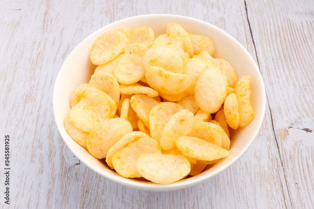 Shrimp chips on wood background Shrimp chips on wood background