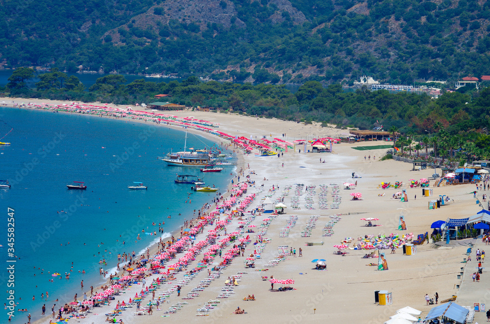 Oludeniz, Turkey - June, 2019: View of the beach in summer day Oludeniz, Turkey - June, 2019: View of the beach in summer day