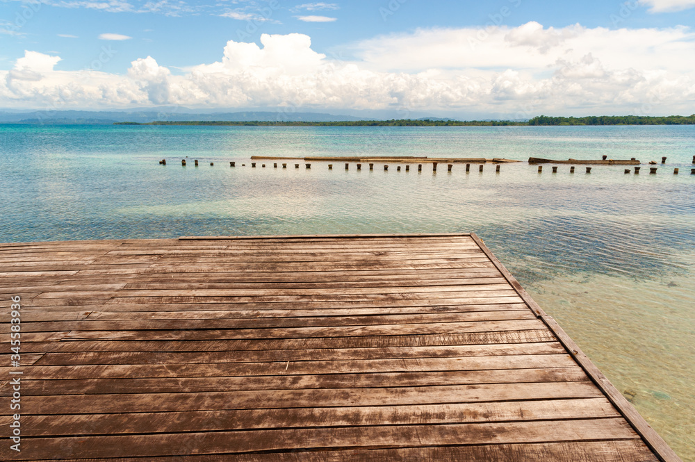 Wooden platform on turquoise sea