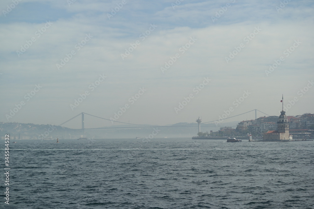 view of the maiden's tower and bosphorus bridge in istanbul turkey
