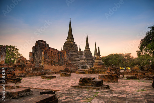 Brick ruins of ancient buddhist temple Wat Phra Si Sanphet at sunset. Architecture of Ayutthaya historical park  Thailand