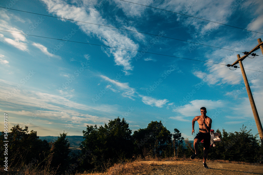Portrait of a silhouette trail runner exercising for fitness Portrait of a silhouette trail runner exercising for fitness