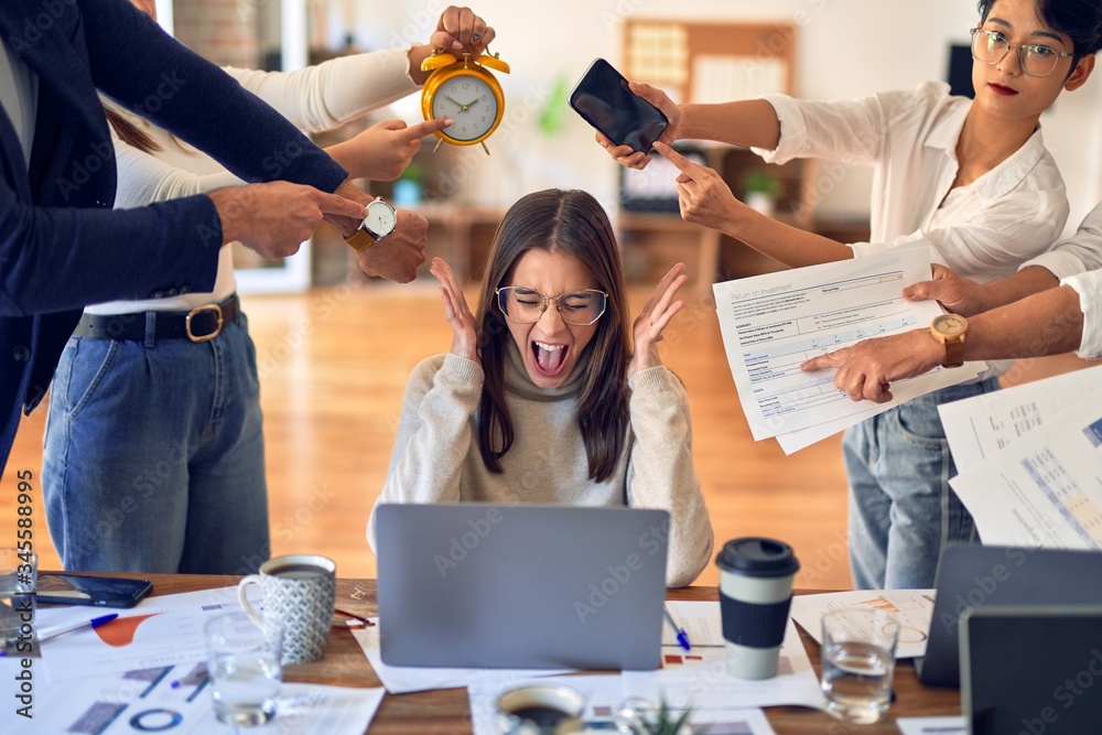 © Krakenimages.com - Group of business workers working together. Partners stressing one of them at the office © Krakenimages.com - Group of business workers working together. Partners stressing one of them at the office