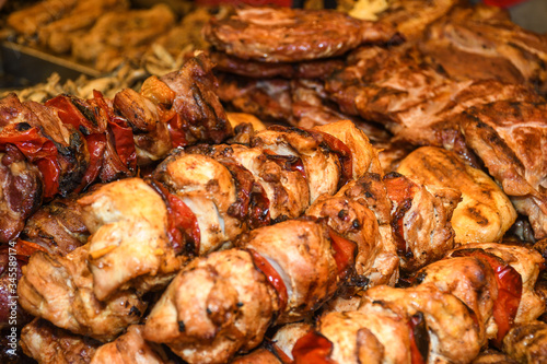 Assorted delicious grilled meat with vegetables over the counter on a barbecue event.