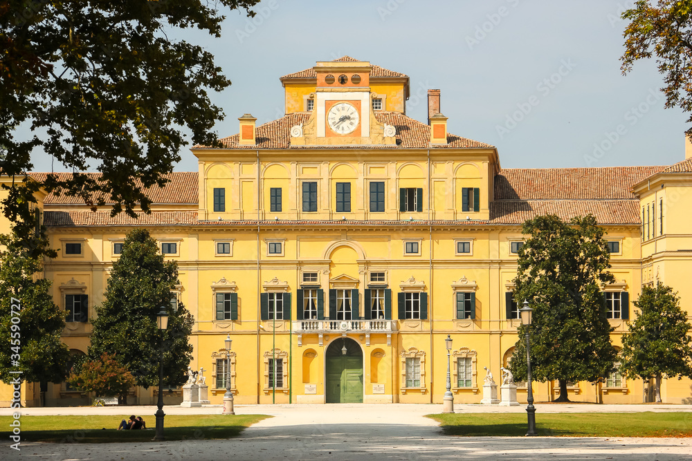 Parma, Italy. Beautiful architecture of Ducal Palace (Palazzo Ducale di Parma) in community garden (Parco Ducale).