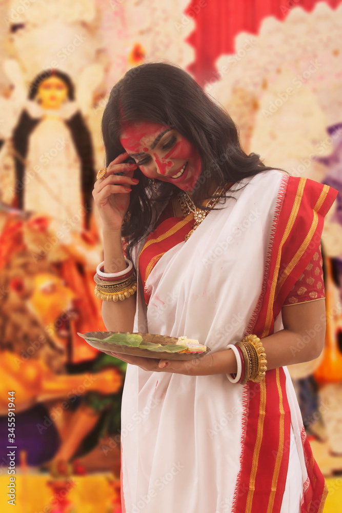 Potrait Of A Bengali Married Woman Holding puja Thali

