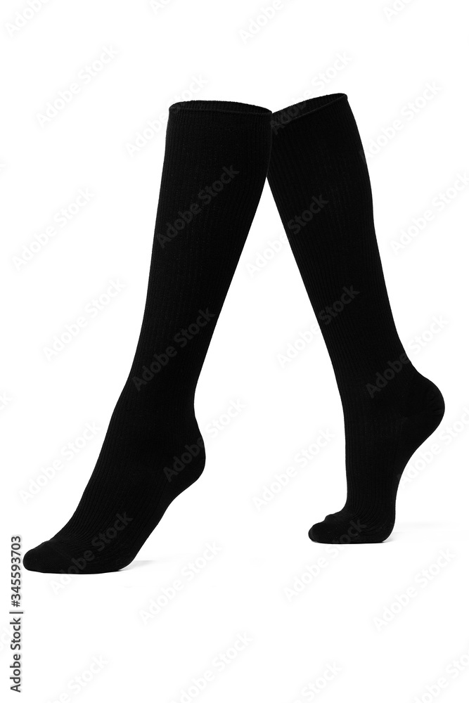 Subject shot of black basic shadow-proof knee socks. The photo is made on the white background. Subject shot of black basic shadow-proof knee socks. The photo is made on the white background.
