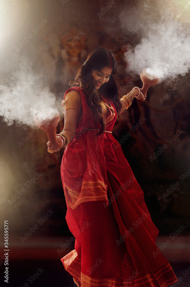 Bengali Married women performing dhunuchi dance on the occasion of ...