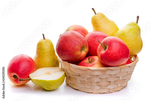 Apples and pears in a wicker basket. Isolate on a white background.