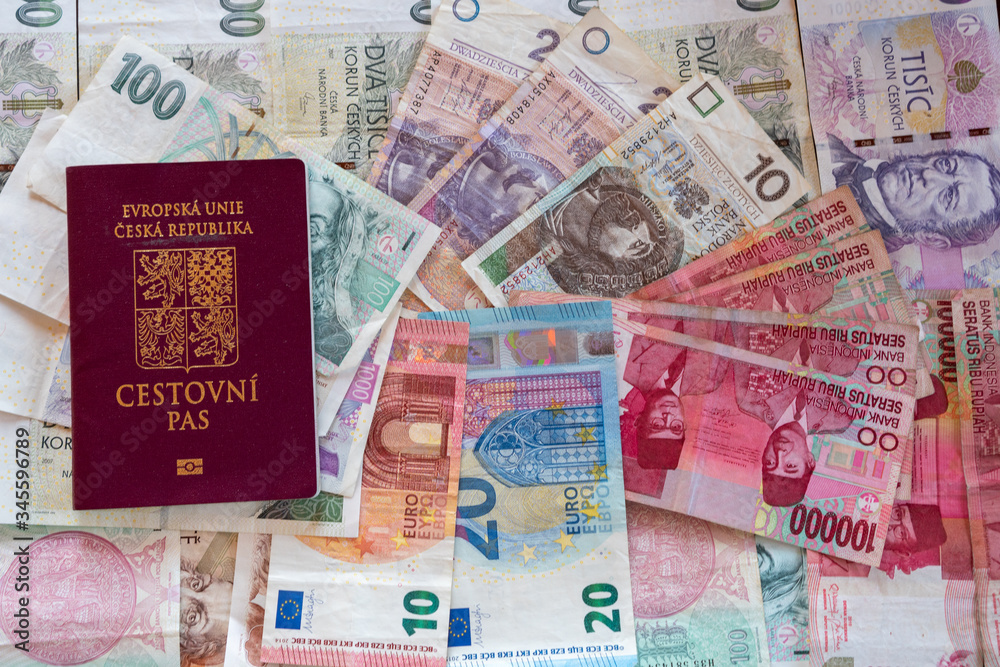 banknotes of different currencies with passport, czech euro IDR CZK PLN