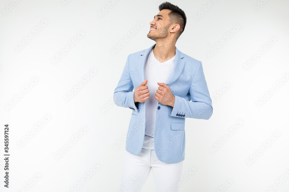 smiling gentleman in a blue jacket posing on a white background with copy space smiling gentleman in a blue jacket posing on a white background with copy space