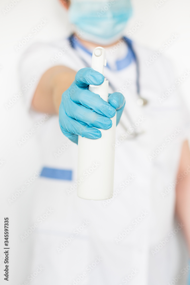 Nurse holding antibacterial fluid for disinfection Nurse holding antibacterial fluid for disinfection