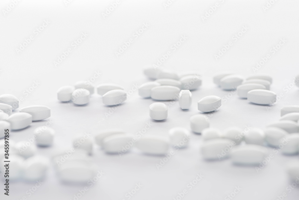 selective focus of probiotic pills on white background selective focus of probiotic pills on white background