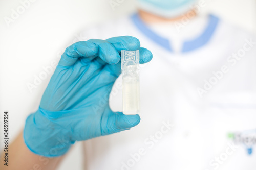 Doctor holding vaccine.Pandemic novel Coronavirus concept 